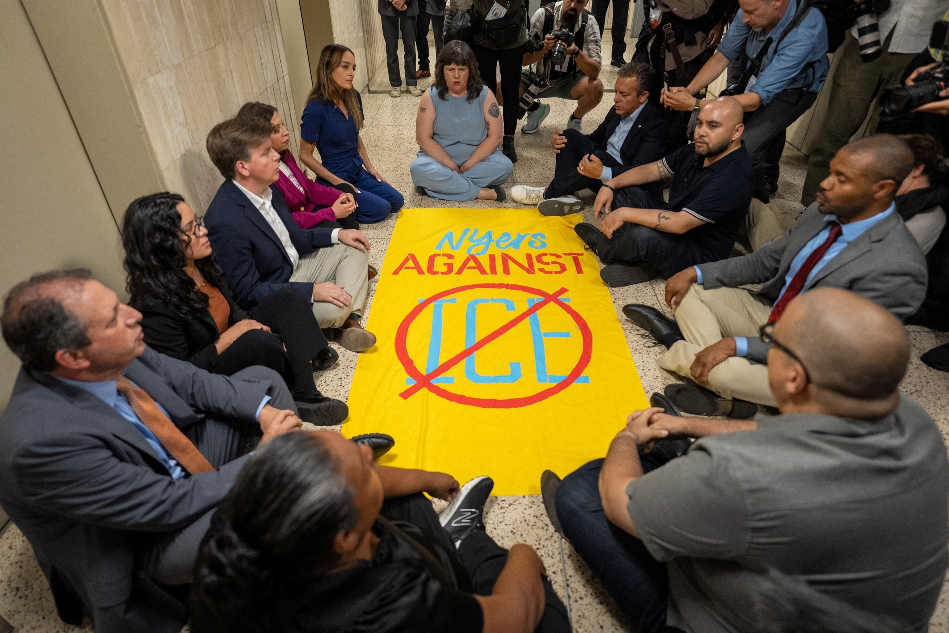 PHOTO: New York state lawmakers and New York City Comptroller Brad Lander conduct a sit in demonstration after being denied access to inspect the conditions of detention cells at U.S. immigration court in New York City